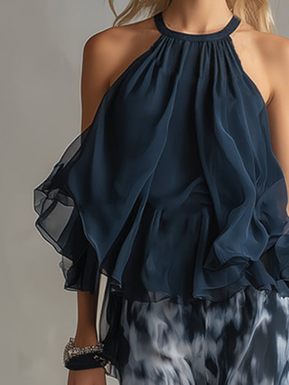 Completo elegante in chiffon con top a collo alto e pantaloni ampi stampati