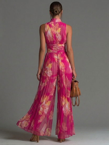 Tuta a maniche corte con stampa floreale rosa, scollo a V e zip