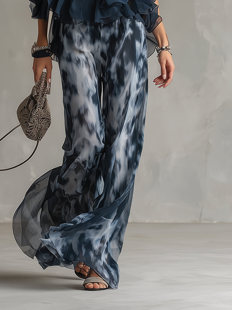 Completo elegante in chiffon con top a collo alto e pantaloni ampi stampati
